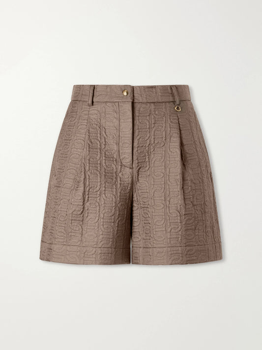 Image of a model wearing Shorts. Product name - Logo-printed Jacquard Shorts in Light brown colour by brand - Moncler