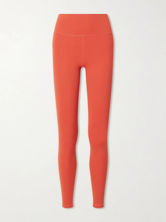 Image of a model wearing Pants. Product name - Always High Rise Stretch Recycled Leggings in Red colour by brand - Varley