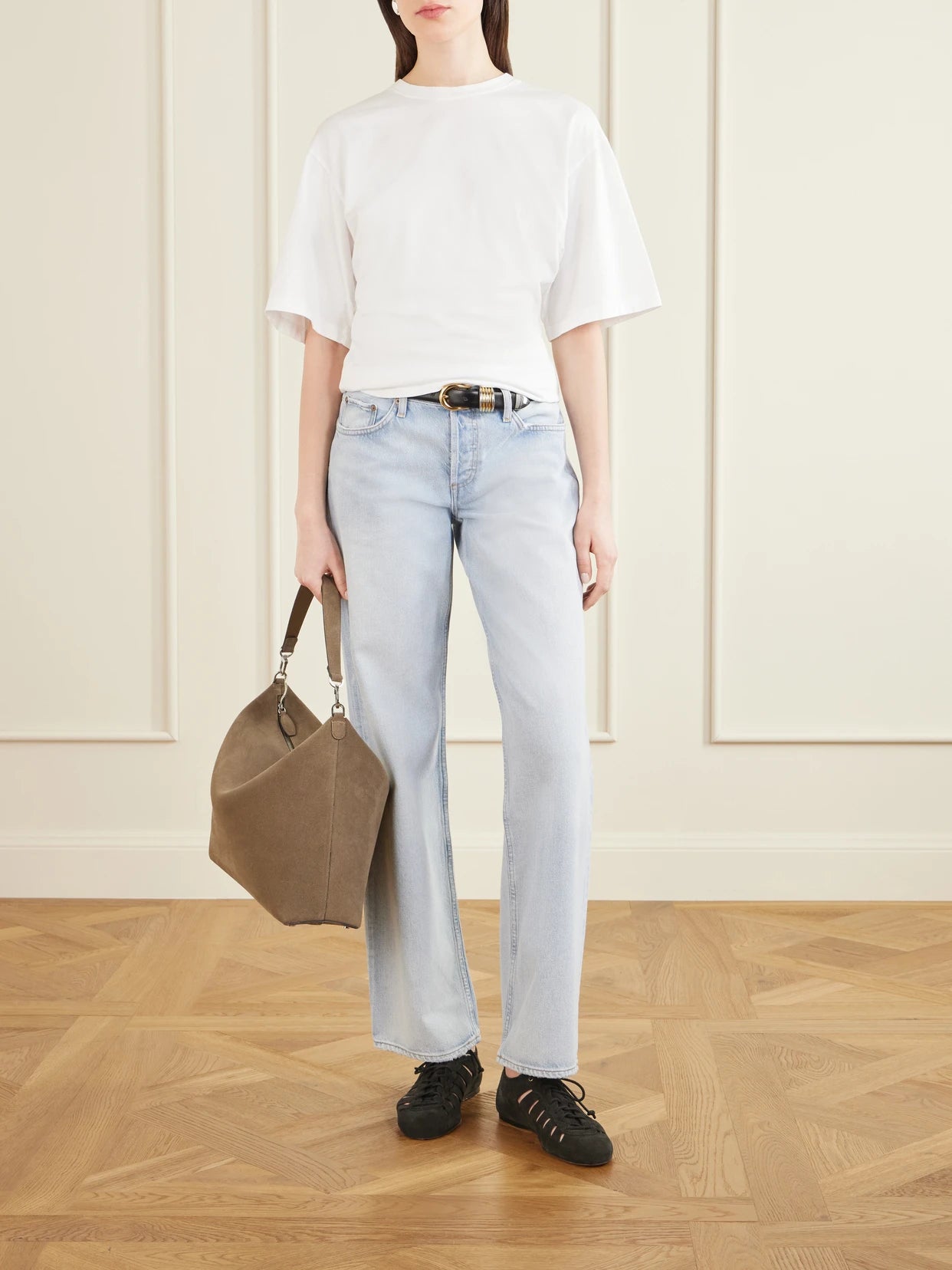 Image of a model wearing Tops. Product name - Storey Gathered Cotton-jersey T-shirt in White colour by brand - AGOLDE