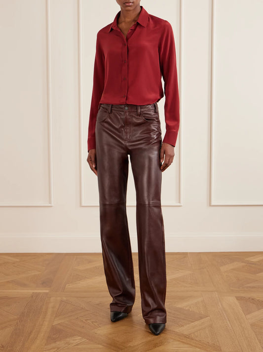 Image of a model wearing Pants. Product name - Joan Paneled Leather Straight-leg Pants in Burgundy colour by brand - Nili Lotan