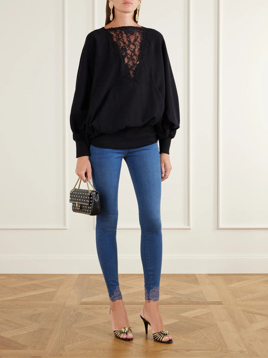 Image of a model wearing Tops. Product name - Lace-trimmed Cotton-jersey Sweatshirt in Black colour by brand - Valentino Garavani