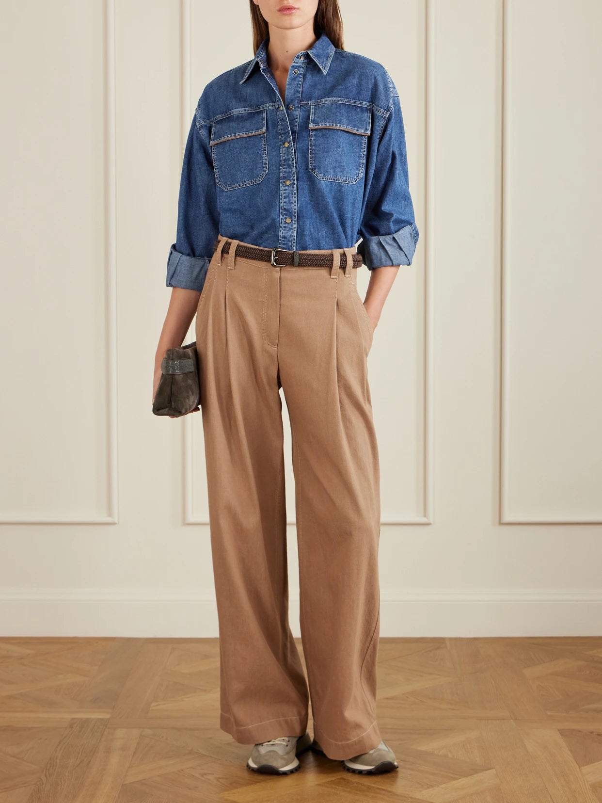 Image of a model wearing Tops. Product name - Bead-embellished Denim Shirt in Light denim colour by brand - Brunello Cucinelli