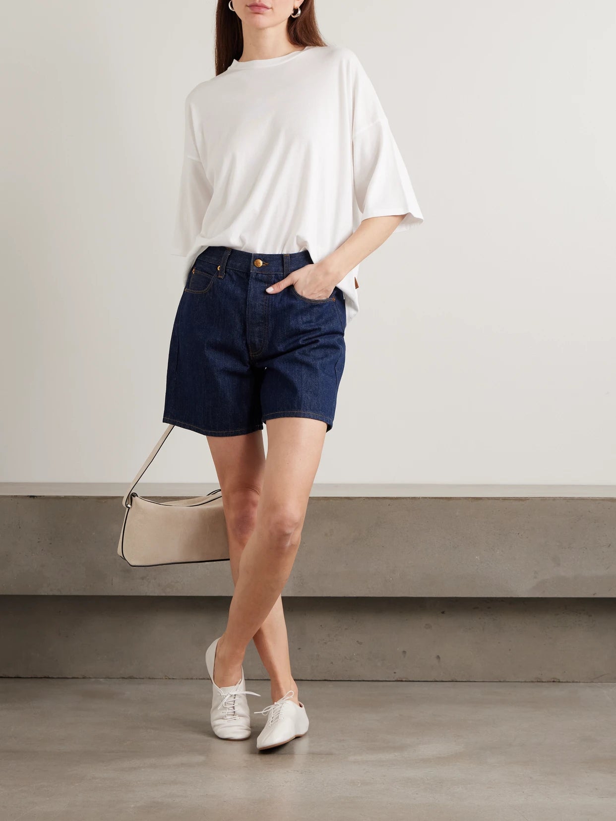 Image of a model wearing Tops. Product name - The Draped Tee Cotton And Modal-blend Jersey T-shirt in White colour by brand - Jamie Haller