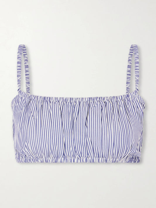 Image of a model wearing Tops. Product name - Bea Shirred Striped Cotton-poplin Bandeau Top in Navy colour by brand - Suzie Kondi