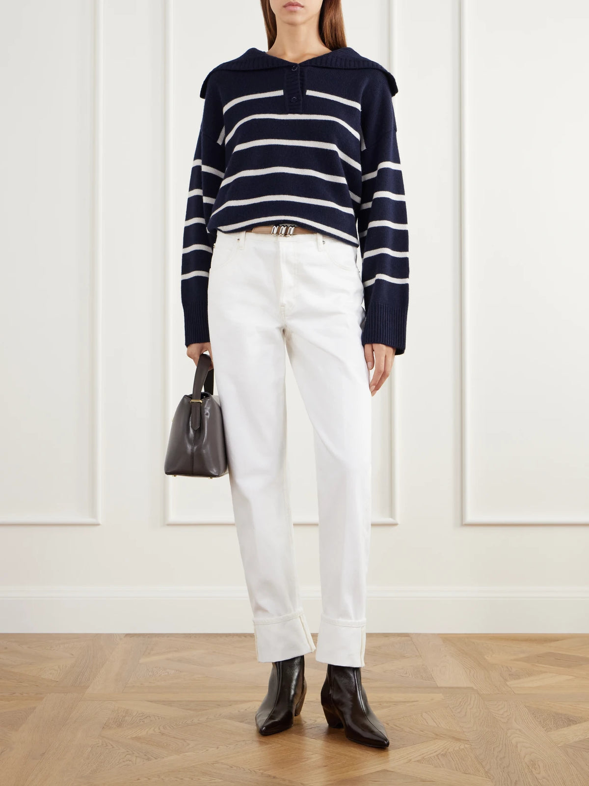 Image of a model wearing Outerwear. Product name - Striped Cashmere Polo Shirt in Navy colour by brand - FRAME