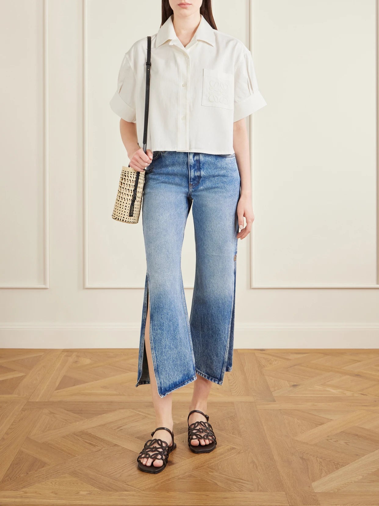 Image of a model wearing Tops. Product name - + Paula's Ibiza Anagram Cotton Shirt in White colour by brand - LOEWE