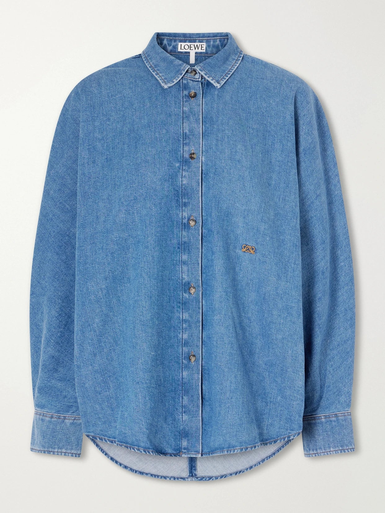 Image of a model wearing Tops. Product name - Anagram-embroidered Denim Shirt in Mid denim colour by brand - LOEWE