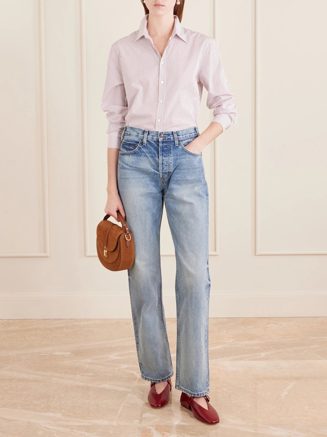 Image of a model wearing Tops. Product name - Raphael Striped Cotton Shirt in Pink colour by brand - Nili Lotan