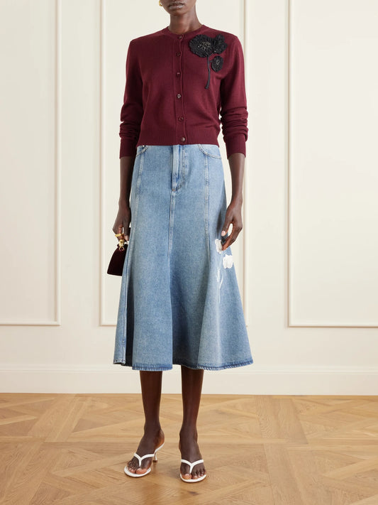Image of a model wearing Outerwear. Product name - Embellished Ribbed Merino Wool Cardigan in Burgundy colour by brand - Erdem