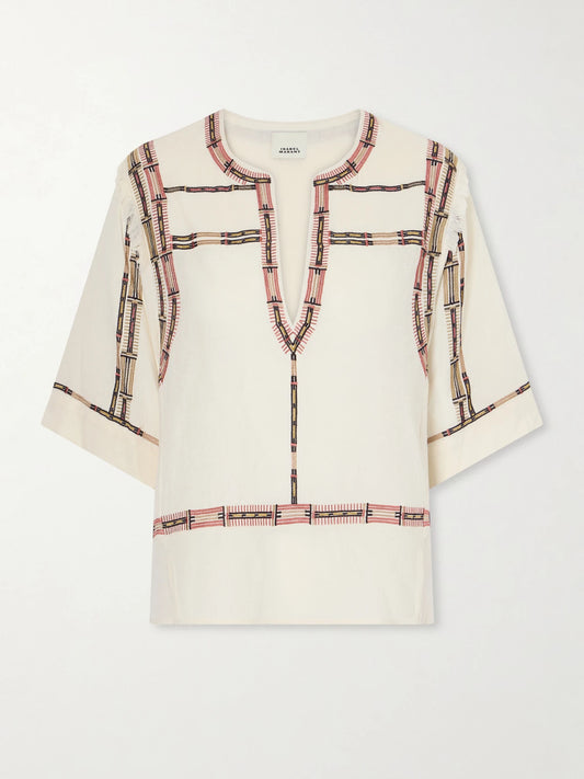 Image of a model wearing Tops. Product name - Fiosa Embroidered Silk Blouse in Ecru colour by brand - ISABEL MARANT