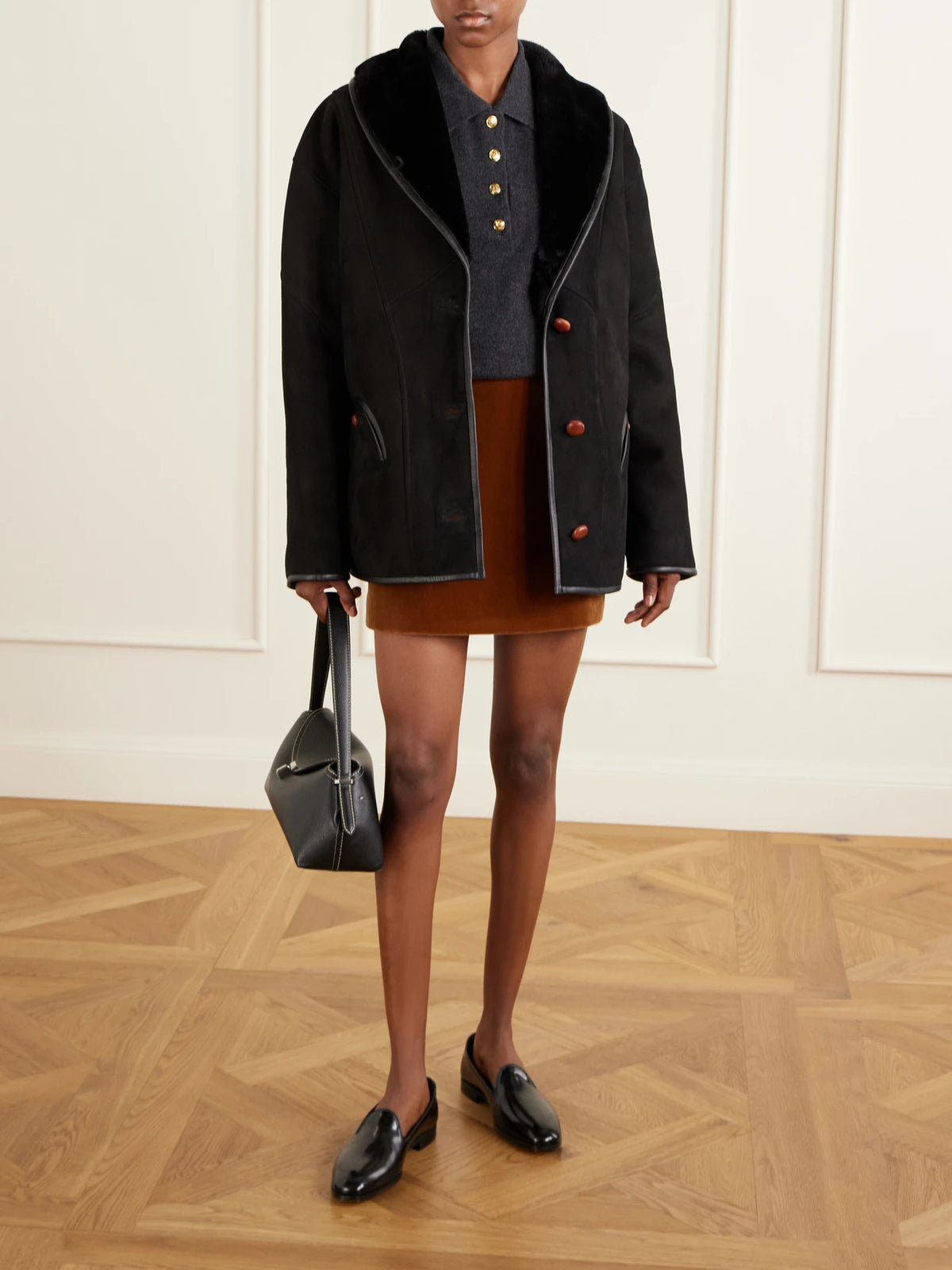 Image of Coats & Jackets. Product name - Tatoosh Shearling Coat in Black colour by brand - BLAZÉ Milano