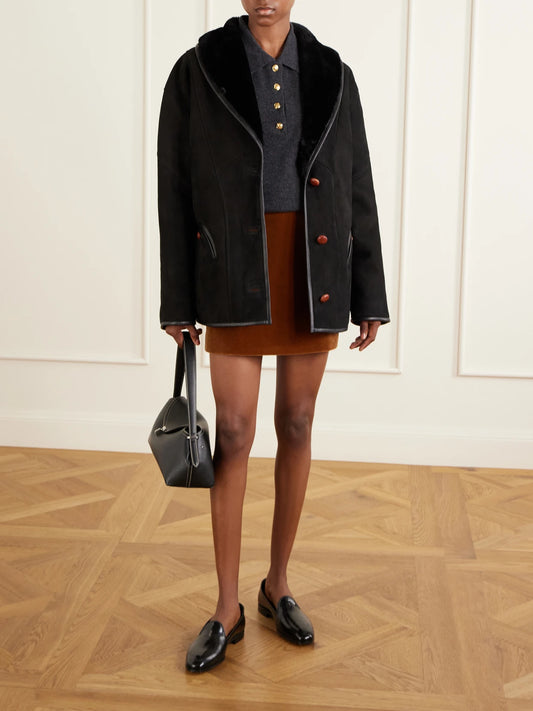 Image of Coats & Jackets. Product name - Tatoosh Shearling Coat in Black colour by brand - BLAZÉ Milano