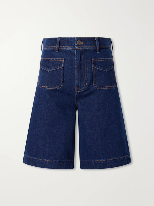 Image of a model wearing Shorts. Product name - Carter Cotton And Silk-blend Denim Shorts in Indigo colour by brand - Veronica Beard