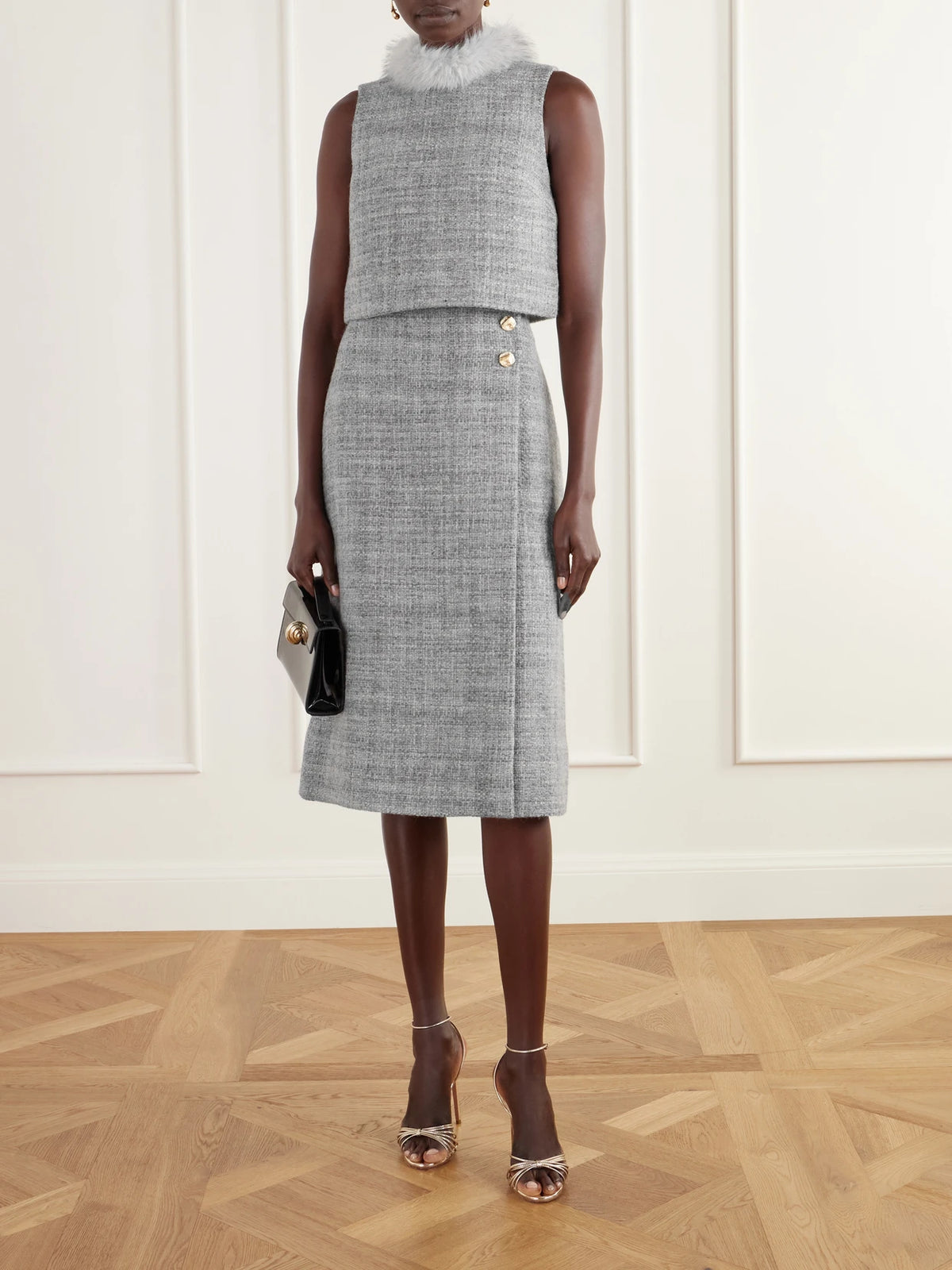 Image of a model wearing Skirts. Product name - Luca Button-detailed Wool-blend Tweed Midi Skirt in Gray colour by brand - Cara Cara