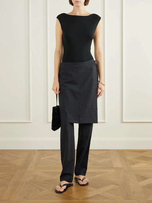 Image of a model wearing Pants. Product name - Layered Wool-blend Skirt-detailed Slim-leg Pants in Black colour by brand - ST. AGNI