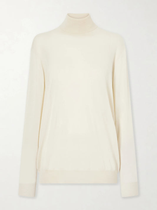 Image of a model wearing Outerwear. Product name - Nabari Cashmere Turtleneck Sweater in Ivory colour by brand - The Row