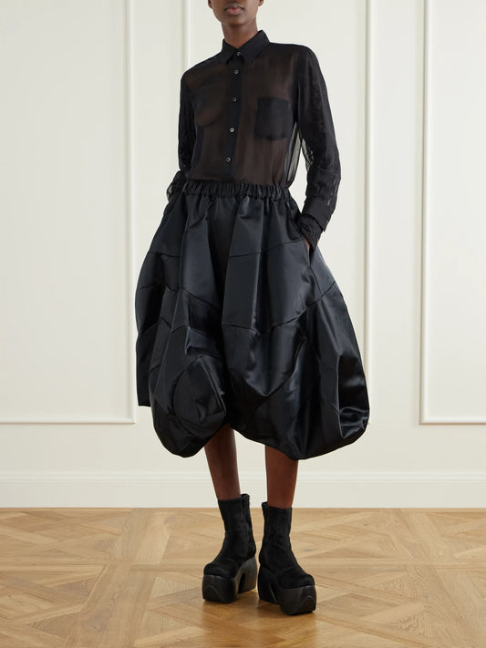 Image of a model wearing Tops. Product name - Georgette Shirt in Black colour by brand - Comme des Garçons