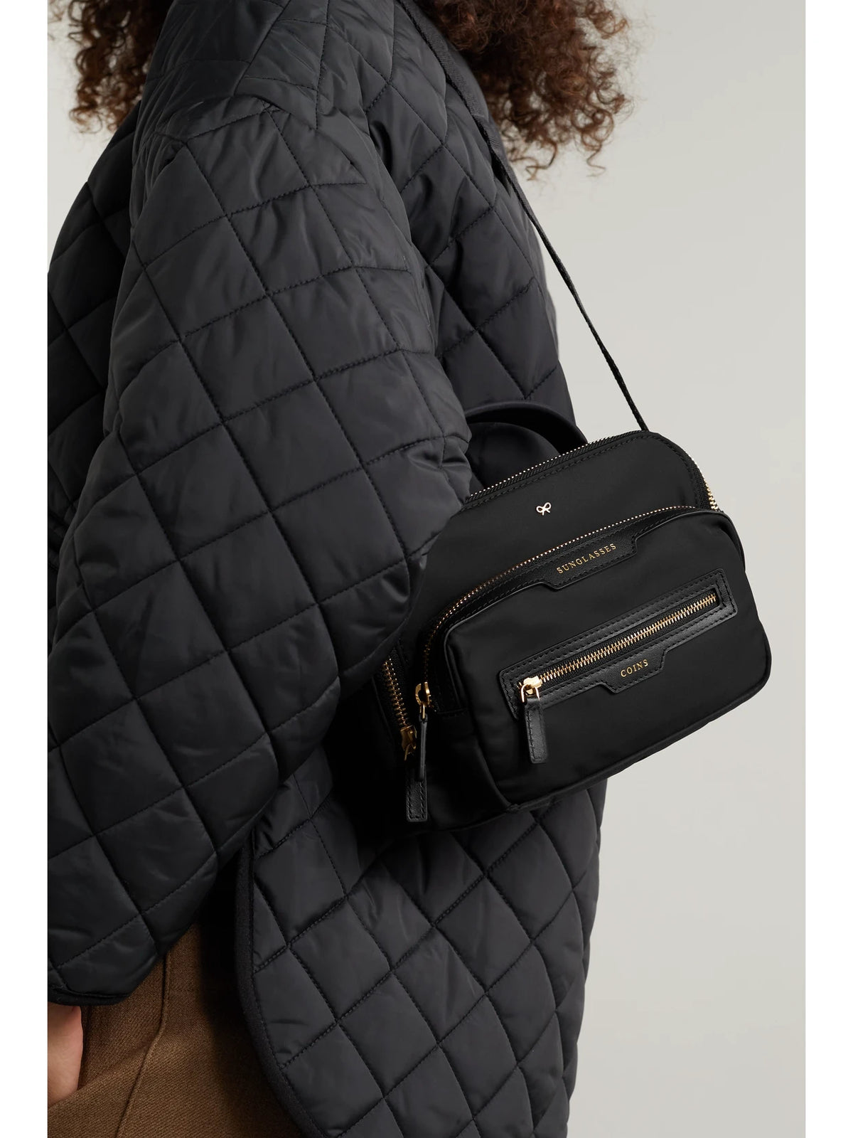 Image of Bags. Product name - + Net Sustain Leather-trimmed Recycled Shell Shoulder Bag in Black colour by brand - Anya Hindmarch