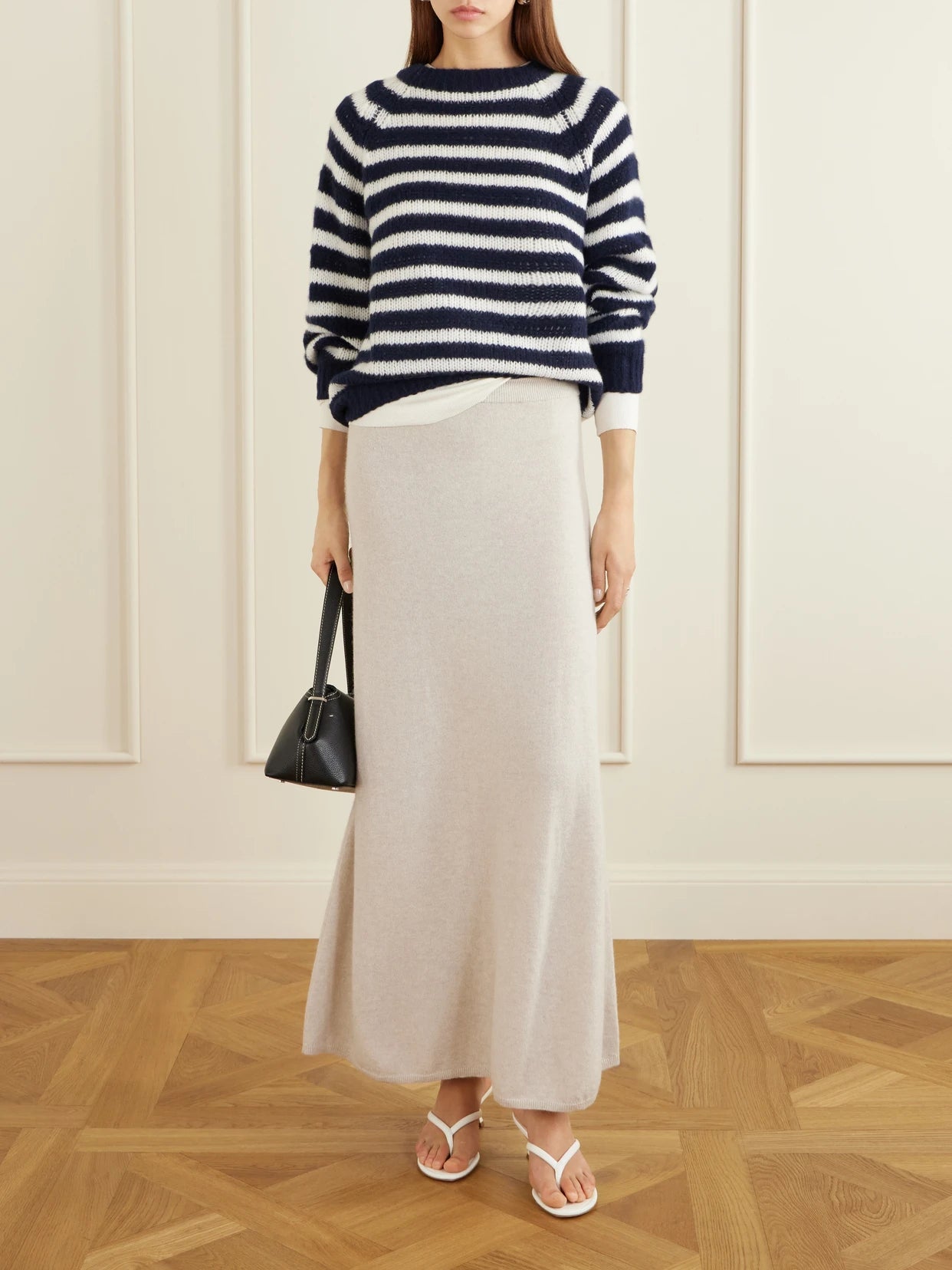Image of a model wearing Outerwear. Product name - Reni Striped Cashmere And Silk-blend Sweater in Navy colour by brand - LISA YANG