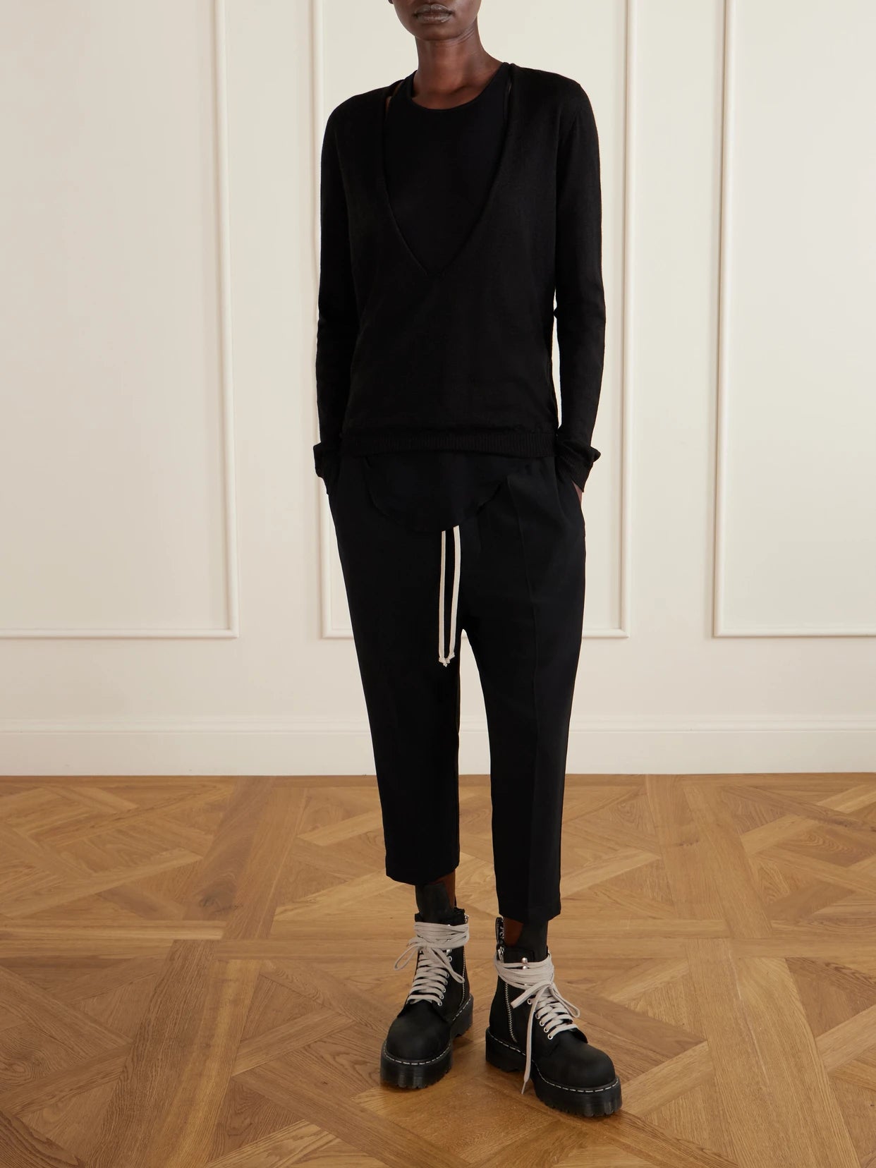 Image of a model wearing Outerwear. Product name - Wool Sweater in Black colour by brand - Rick Owens