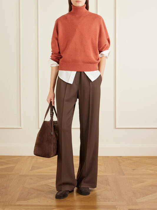 Image of a model wearing Outerwear. Product name - Cashmere Turtleneck Sweater in Red colour by brand - Brunello Cucinelli