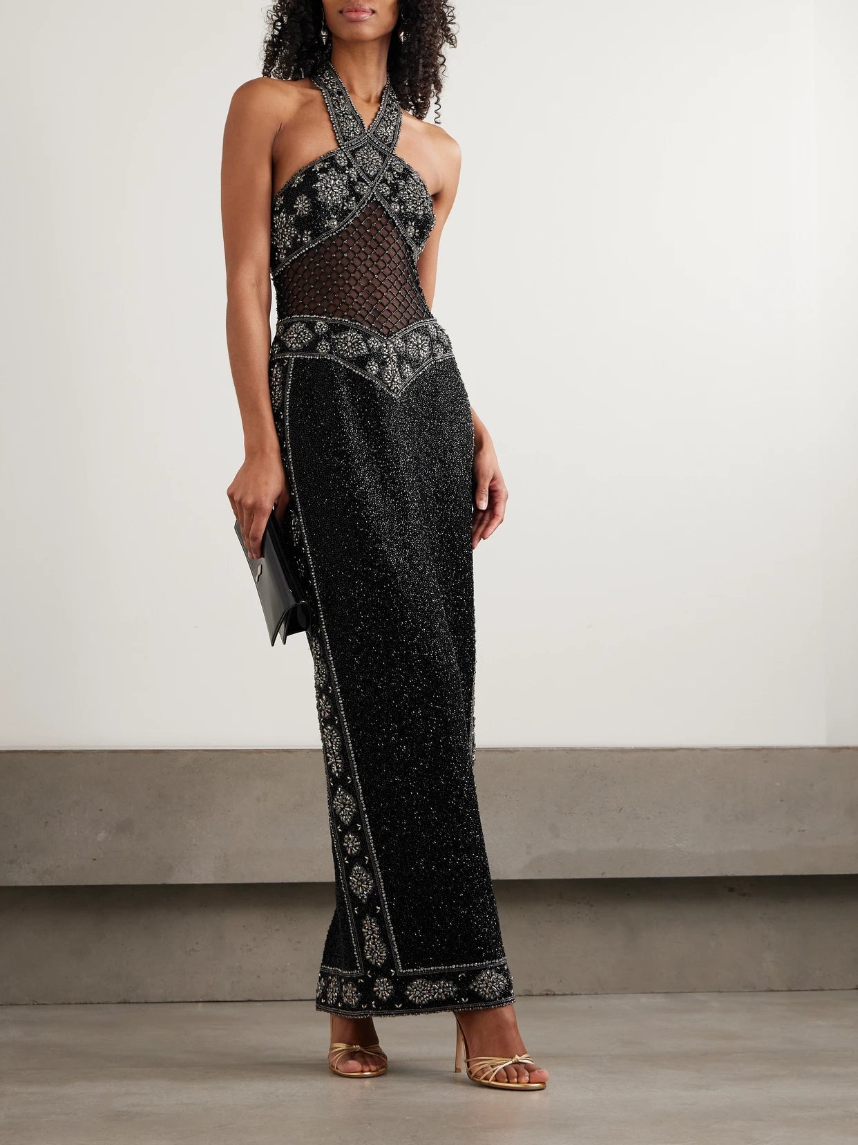 Image of Dresses. Product name - Cyndi Cutout Embellished Mesh Halterneck Gown in Black colour by brand - Clio Peppiatt