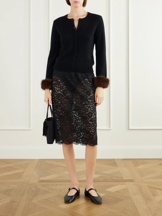 Image of a model wearing Skirts. Product name - Nandette Lace Knee-lenght Skirt in Black colour by brand - DÔEN