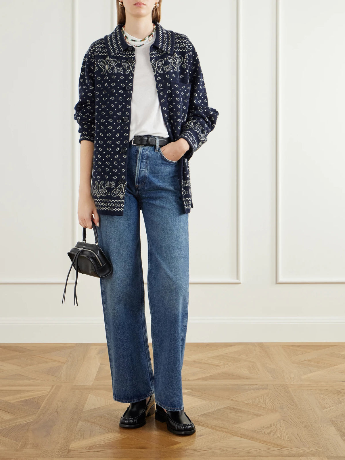 Image of a model wearing Outerwear. Product name - Intarsia Cashmere Cardigan in Navy colour by brand - Guest In Residence
