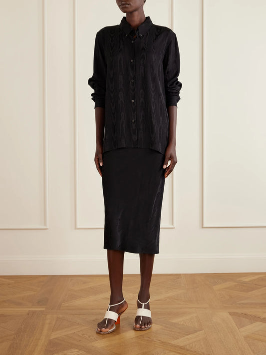 Image of a model wearing Skirts. Product name - Moire Midi Skirt in Black colour by brand - Dries Van Noten