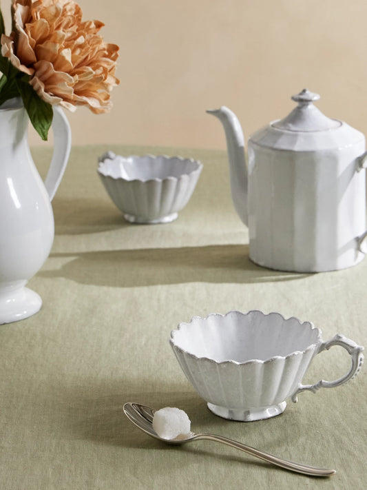 Image of Tableware. Product name - Marguerite Ceramic Tea Cup in White colour by brand - Astier De Villatte
