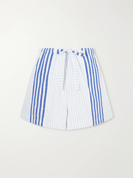 Image of a model wearing Shorts. Product name - Safia Striped Cotton Shorts in Blue colour by brand - lemlem