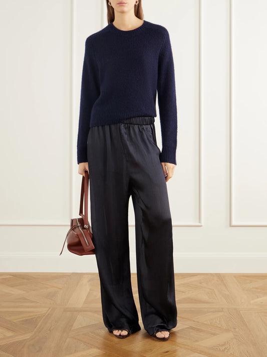 Image of a model wearing Pants. Product name - Winslow Plissé-satin Wide-leg Pants in Navy colour by brand - Tibi