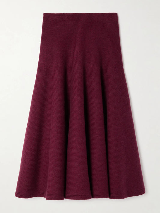 Image of a model wearing Skirts. Product name - Pleated Knitted Cashmere-blend Midi Skirt in Burgundy colour by brand - Alaïa