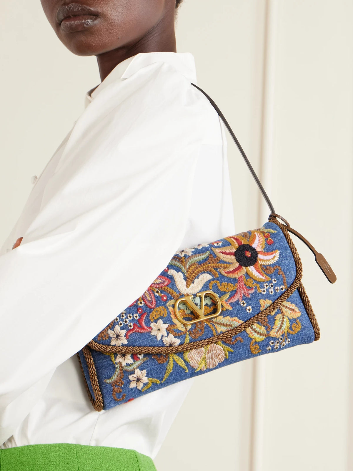 Image of Bags. Product name - Devain Small Leather-trimmed Embroidered Denim Shoulder Bag in Multi colour by brand - Valentino Garavani