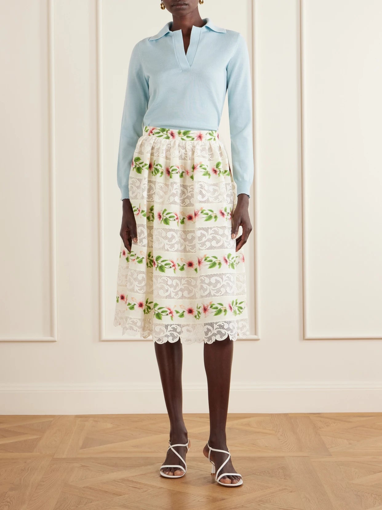 Image of a model wearing Outerwear. Product name - Wool Polo Sweater in Light blue colour by brand - Oscar de la Renta