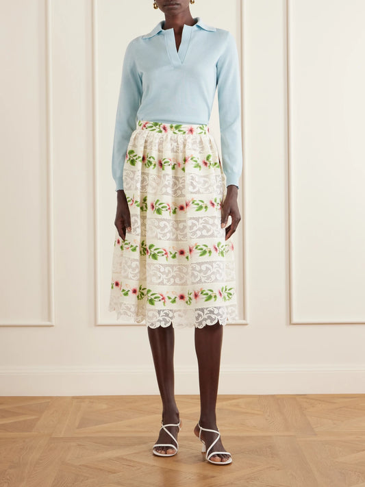 Image of a model wearing Outerwear. Product name - Wool Polo Sweater in Light blue colour by brand - Oscar de la Renta