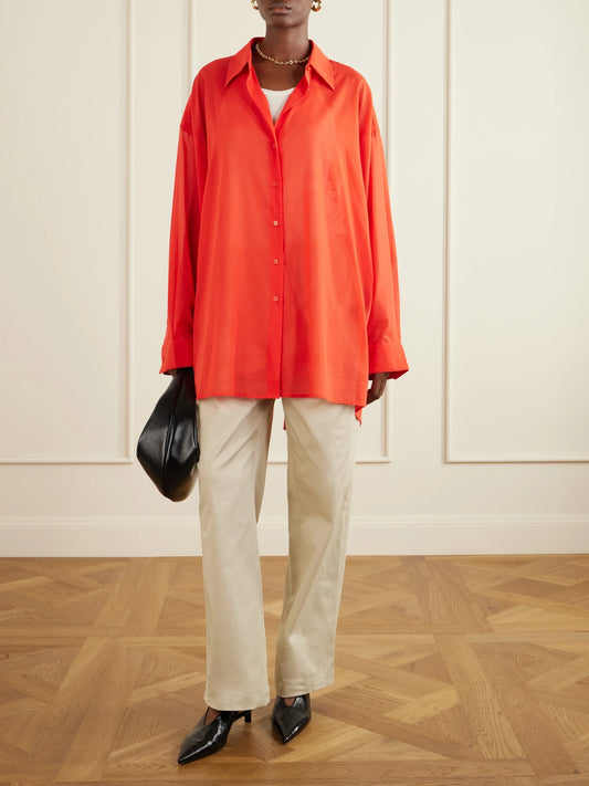 Image of a model wearing Tops. Product name - Melia Open-back Cotton Shirt in Red colour by brand - The Frankie Shop