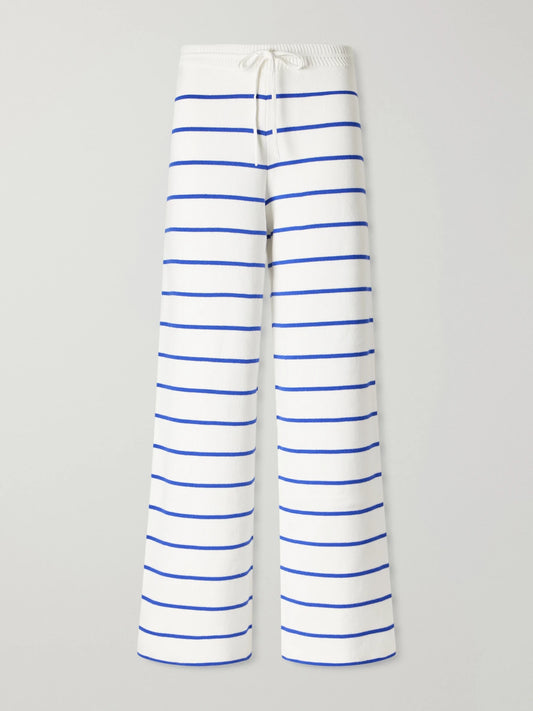 Image of a model wearing Pants. Product name - Striped Cotton Wide-leg Pants in White colour by brand - La Ligne