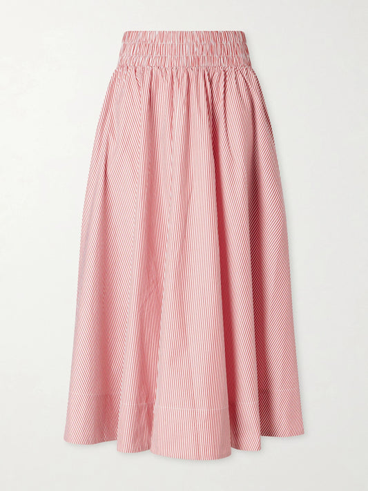 Image of a model wearing Skirts. Product name - Kyria Shirred Striped Cotton-poplin Midi Skirt in Pink colour by brand - Suzie Kondi