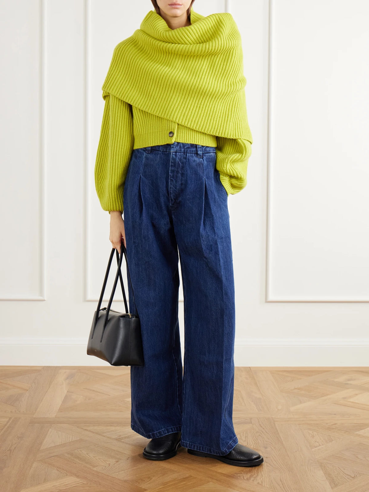 Image of a model wearing Outerwear. Product name - The Cadogan Cropped Ribbed Cashmere Cardigan in Chartreuse colour by brand - RÙADH