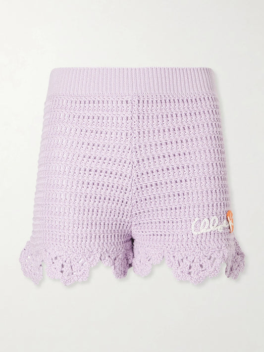 Image of a model wearing Shorts. Product name - Appliquéd Crocheted Cotton Shorts in Purple colour by brand - Chloé