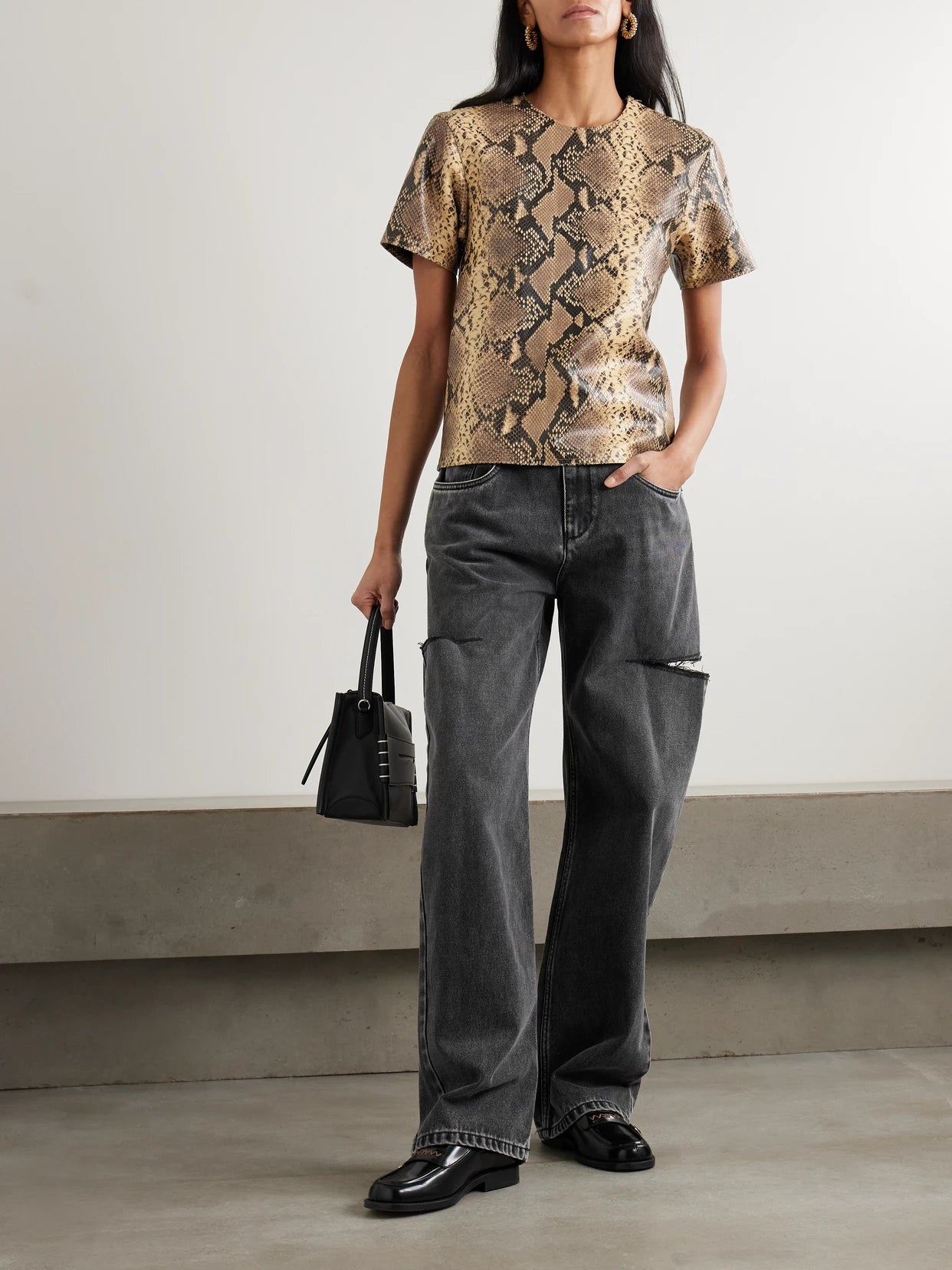 Image of Jeans. Product name - Cutout High-rise Wide-leg Jeans in Black colour by brand - Maison Margiela