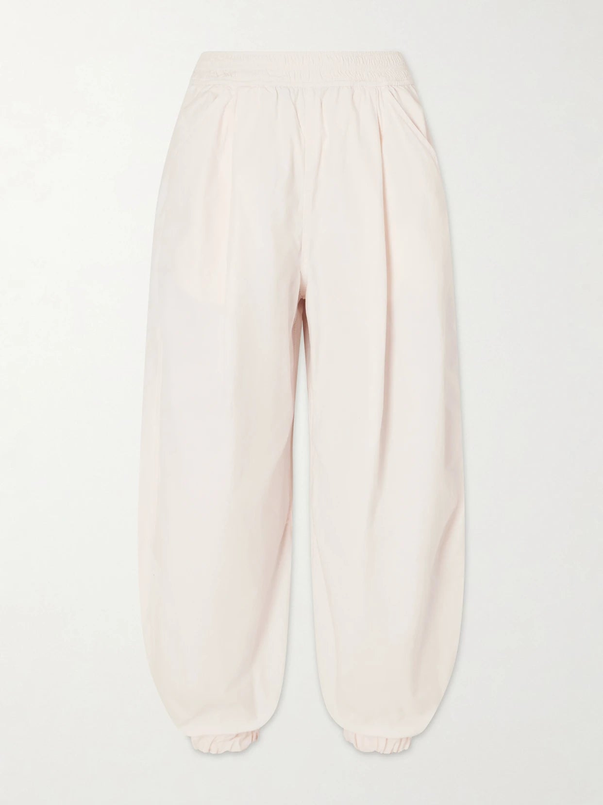 Image of a model wearing Pants. Product name - Forbes Organic Cotton-poplin Balloon Pants in Pastel pink colour by brand - RÙADH