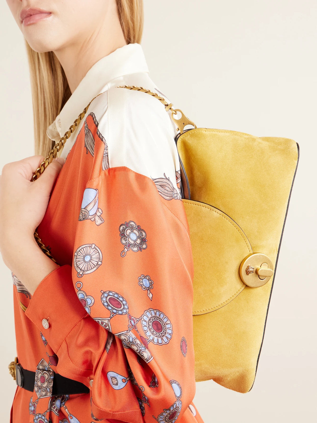 Image of Bags. Product name - Vivienne Logo-embellished Suede Clutch in Mustard colour by brand - Versace