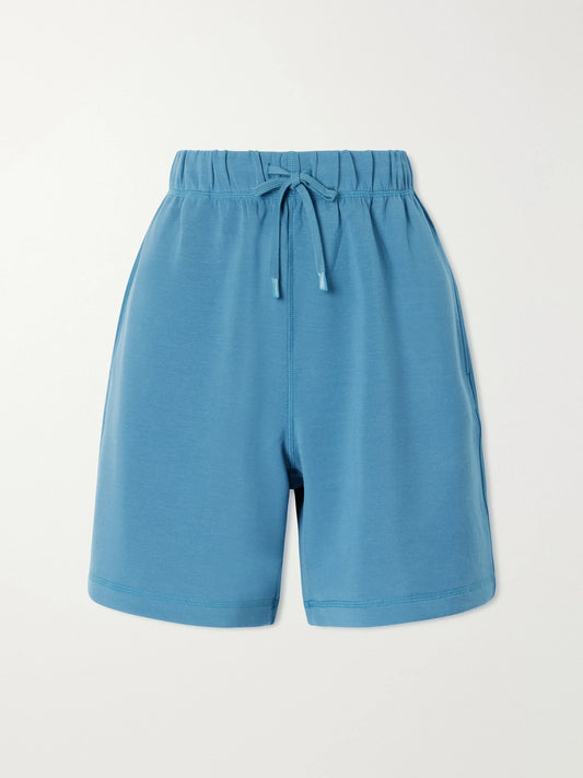 Image of a model wearing Shorts. Product name - Rumer Jersey Shorts in Blue colour by brand - Varley