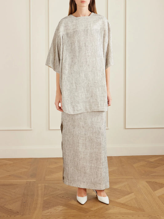 Image of a model wearing Skirts. Product name - Blum Linen And Silk-blend Gauze Midi Skirt in Gray colour by brand - The Row