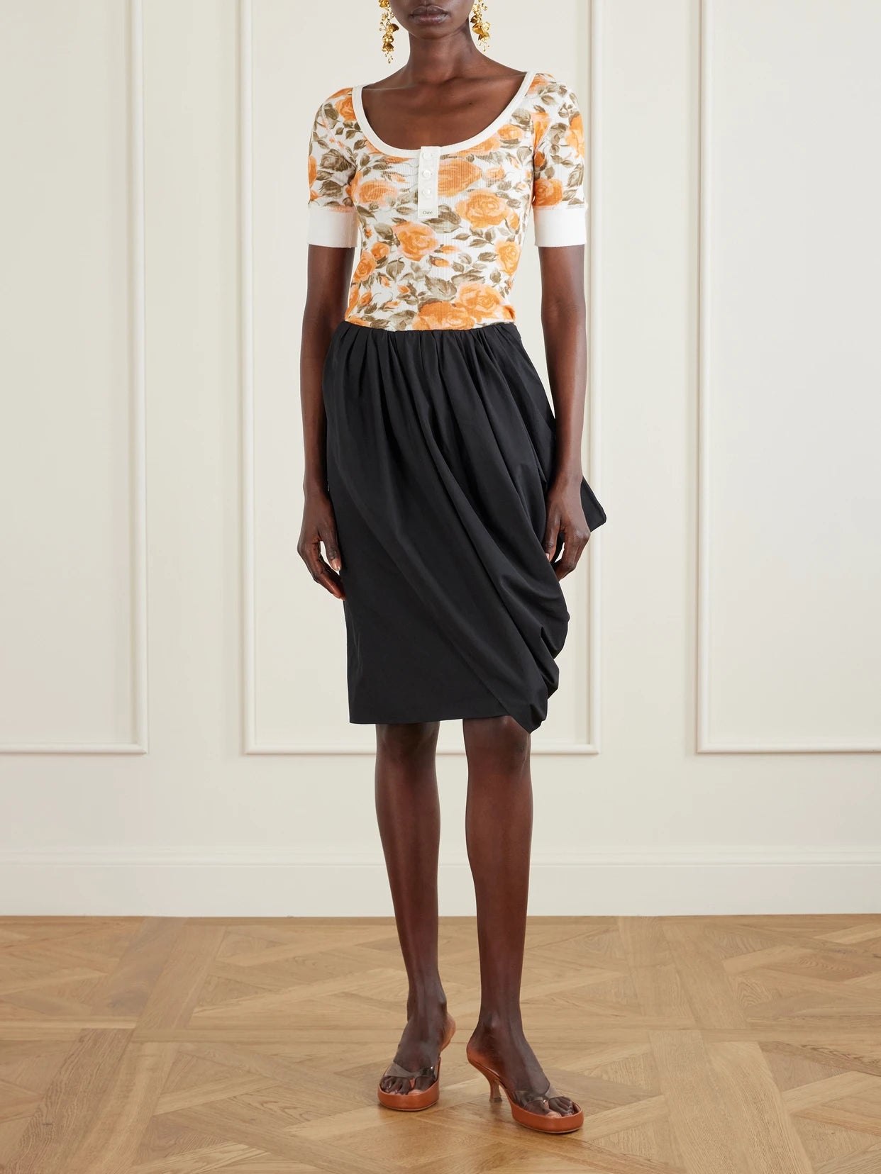 Image of a model wearing Skirts. Product name - Asymmetric Draped Cotton-poplin Skirt in Black colour by brand - Chloé