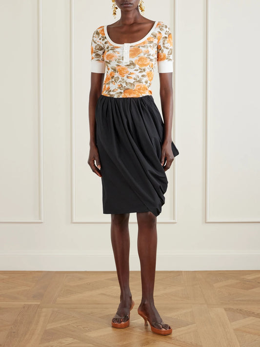 Image of a model wearing Skirts. Product name - Asymmetric Draped Cotton-poplin Skirt in Black colour by brand - Chloé
