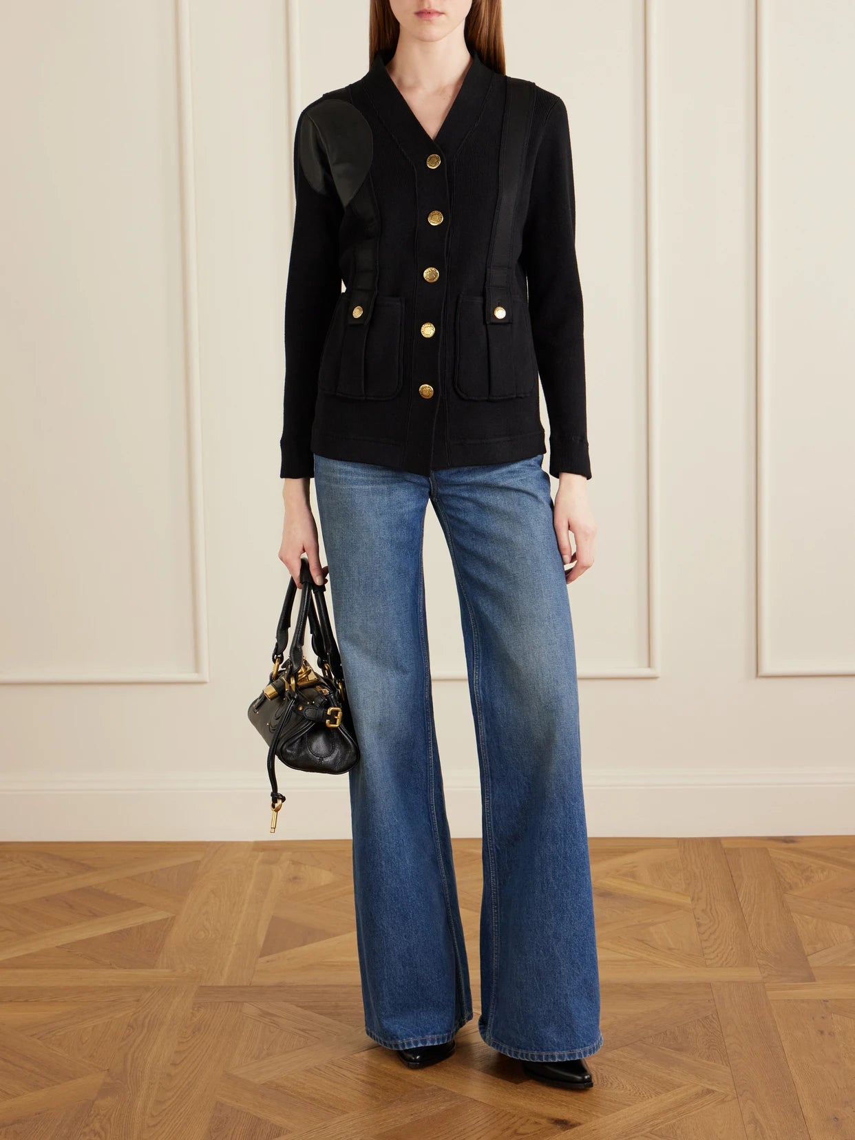 Image of a model wearing Outerwear. Product name - Yates Grosgrain And Leather Trimmed Wool And Cotton-blend Cardigan in Black colour by brand - MAISON MAYLE
