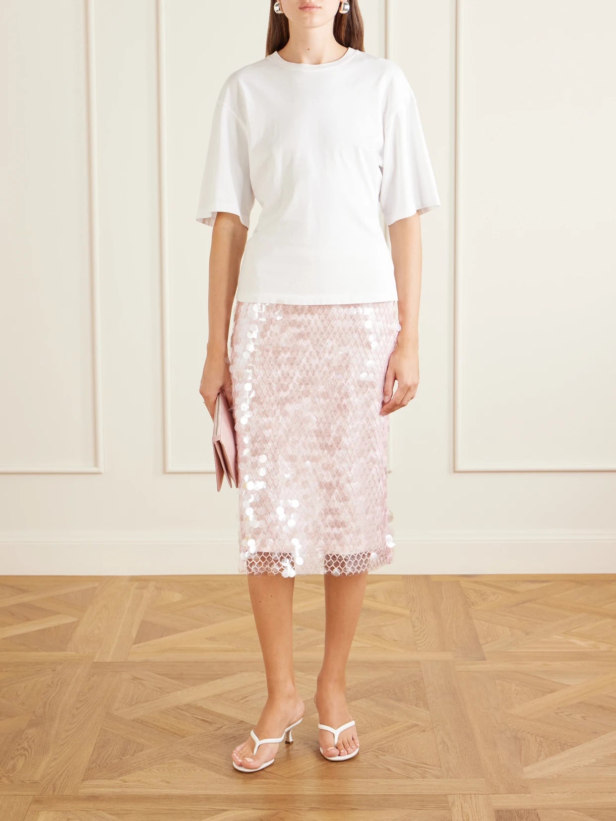 Image of a model wearing Skirts. Product name - Sequin-embellished Mesh-jersey Midi Skirt in Off-white colour by brand - Tory Burch